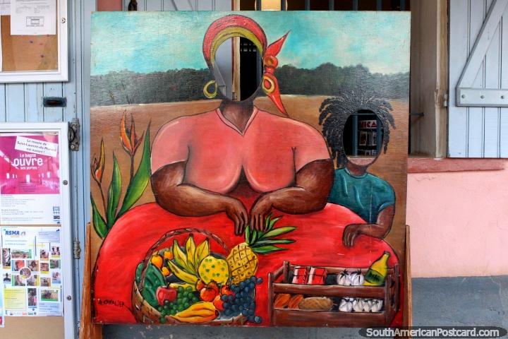 Painting of a woman with a fruit basket, with face holes, Saint Laurent du Maroni, French Guiana. (720x480px). The 3 Guianas, South America.