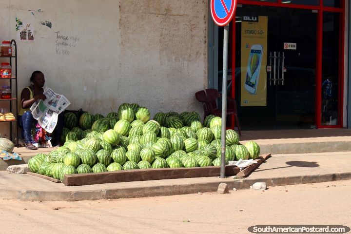 A woman sells watermelons on an Albina street corner in Suriname. (720x480px). The 3 Guianas, South America.