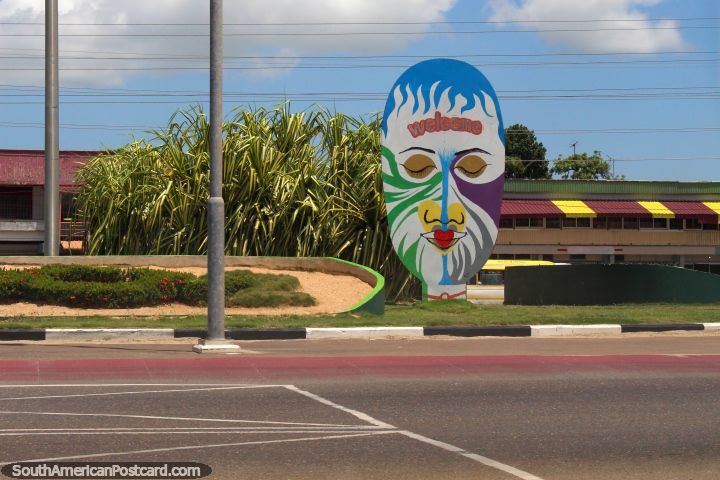 A colorful face mural welcomes you to Paramaribo after the bridge, Suriname. (720x480px). The 3 Guianas, South America.