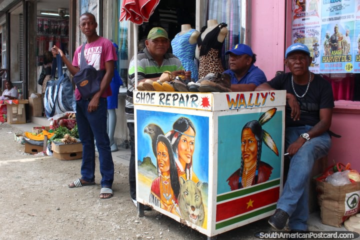 Wallys Shoe Repair with 3 men and images of indigenous in Paramaribo, Suriname. (720x480px). The 3 Guianas, South America.