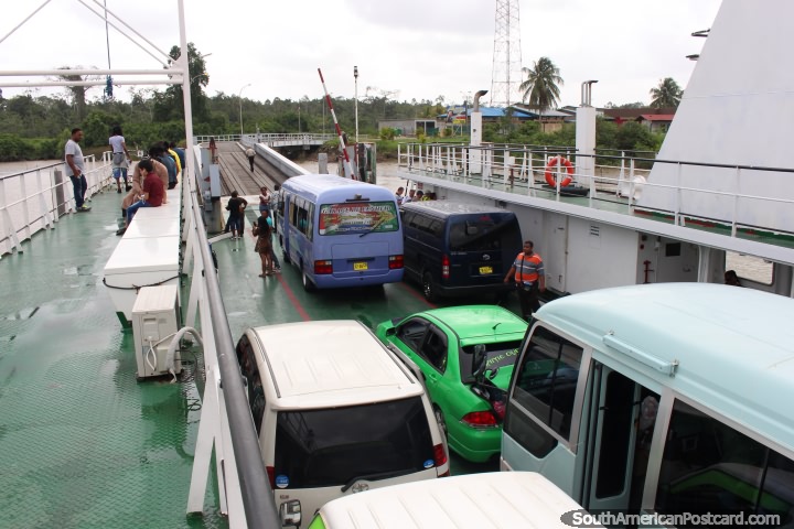 Ferry loaded up with vehicles and people, leaving South Drain in Suriname for Moleson Creek, Guyana. (720x480px). The 3 Guianas, South America.