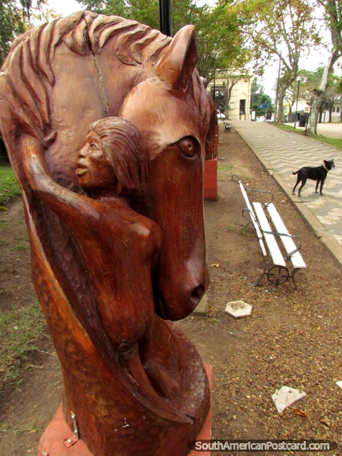 Horse wooden sculpture at Plaza San Martin in Colon. (480x640px). Argentina, South America.