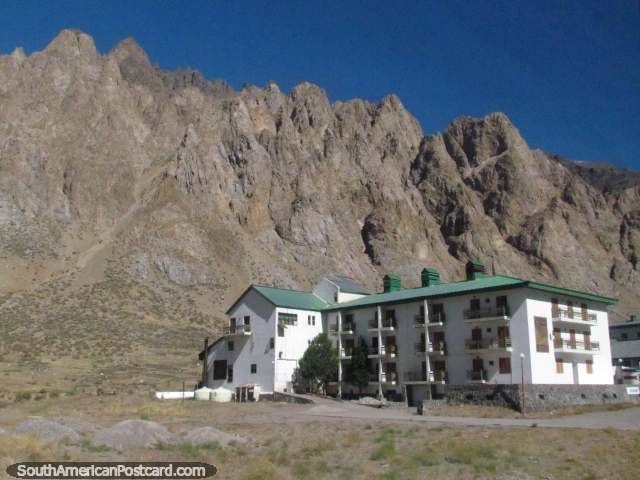 Hotel Ayelen with a jagged rock backdrop near the Rio Mendoza. (640x480px). Argentina, South America.