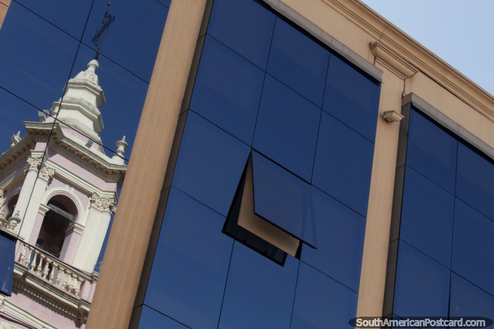 Reflection of the bell-tower of the cathedral in Salta in a nearby building window. (720x480px). Argentina, South America.