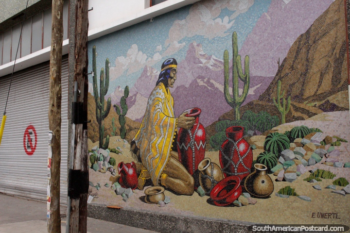 Indigenous man with ceramic pots below mountains and cactus, mural in Salta. (720x480px). Argentina, South America.