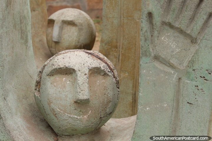 Round sculptured heads of concrete and a hand, art at Parque San Martin in Salta. (720x480px). Argentina, South America.