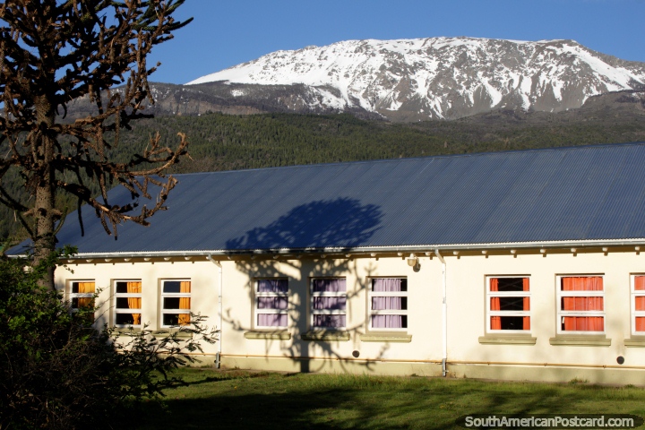 School in El Bolson, Escuela No 270 (1909) is a national monument and has a beautiful view of snow-capped mountain ranges behind it! (720x480px). Argentina, South America.