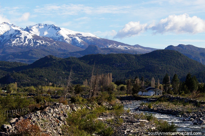 Rocky river, a house, trees and mountains, a beautiful wilderness near the border of Argentina and Chile from Trevelin. (720x480px). Argentina, South America.