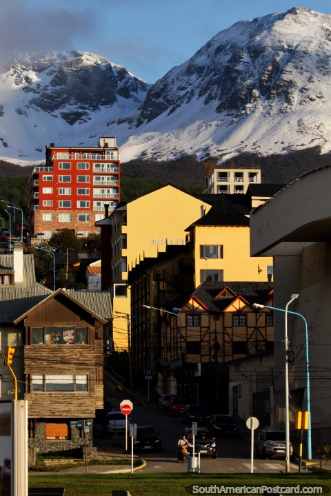 Buildings in the center of Ushuaia glow in the morning sun around 6am. (480x720px). Argentina, South America.
