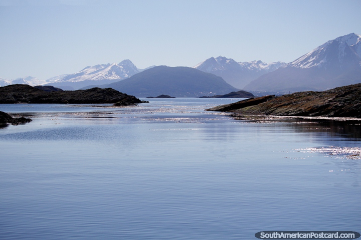 Peaceful scenery of hazy blue with mountains and rocky islands in Ushuaia. (720x480px). Argentina, South America.