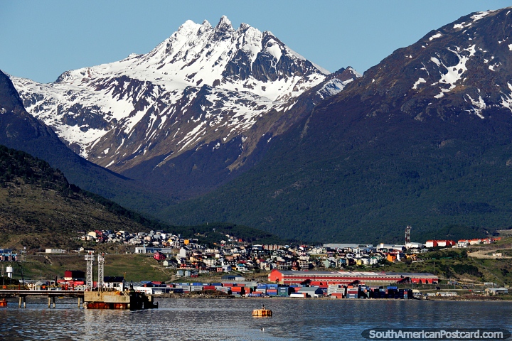 Cargo at the port, houses on the hills and gigantic mountains in Ushuaia. (720x480px). Argentina, South America.