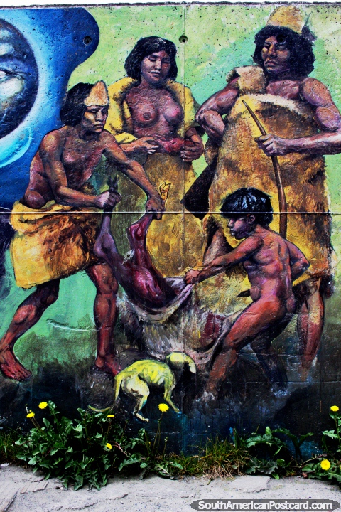 Os povos indïgenas da Terra do Fogo pegam um animal, arte de rua em Ushuaia. (480x720px). Argentina, América do Sul.