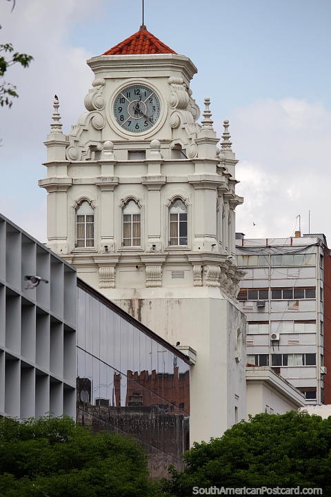 Distant clock tower of one of many historic buildings seen in Cordoba. (480x720px). Argentina, South America.