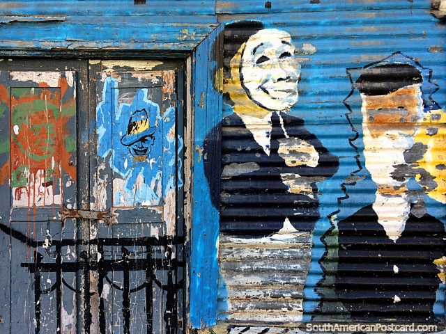 Derelict but artistic, street art on an old door and corrugated iron building in Buenos Aires. (640x480px). Argentina, South America.