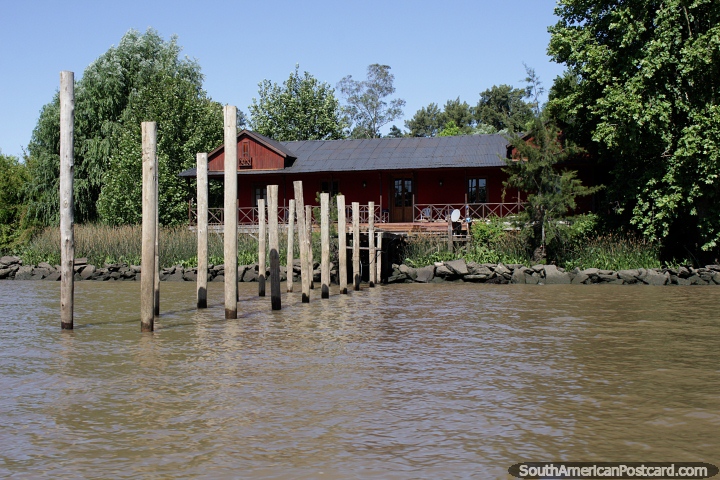 Large wooden house and newly built jetty beside the river in Tigre, Buenos Aires. (720x480px). Argentina, South America.