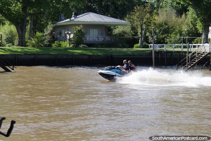 Jet skiing along the rivers of the delta in Tigre, northern Buenos Aires. (720x480px). Argentina, South America.