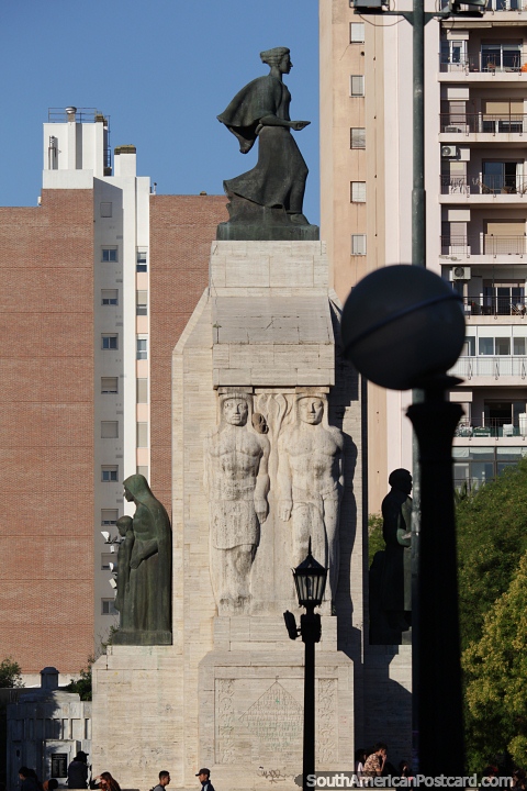 An array of figures as part of the monument at the plaza in Bahia Blanca. (480x720px). Argentina, South America.