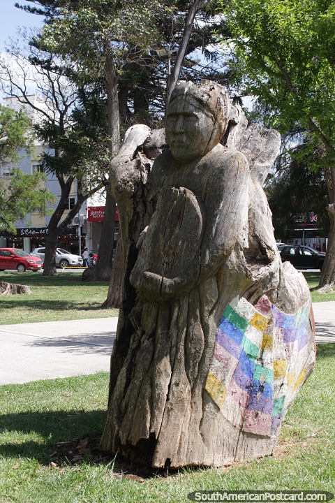 Wooden carving of a woman at Plaza Alsina in Viedma. (480x720px). Argentina, South America.