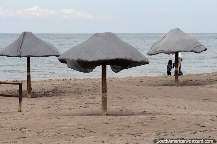 Umbrellas on the beach in Puerto Madryn, waiting for the people to arrive. (720x480px). Argentina, South America.