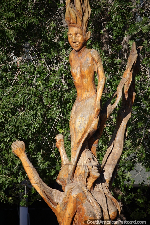 Wooden sculpture, a cultural dance in Puerto Madryn. (480x720px). Argentina, South America.