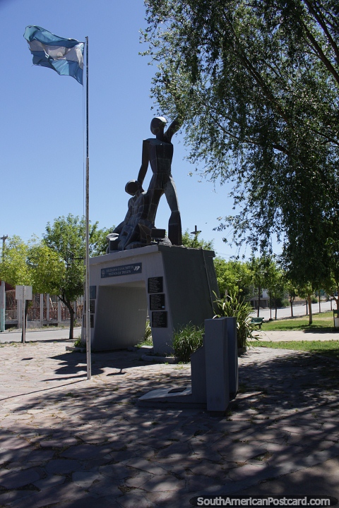 Monument to the fallen at the Malvina Islands in Trelew, flag flies. (480x720px). Argentina, South America.
