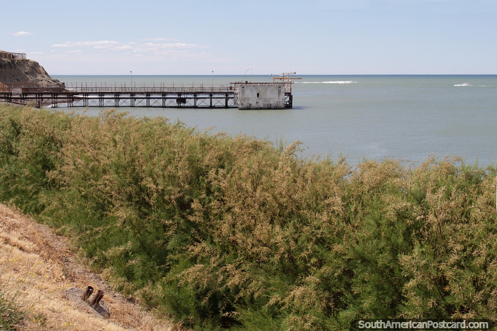 Dock and green seas on the waterfront in Caleta Olivia. (720x480px). Argentina, South America.