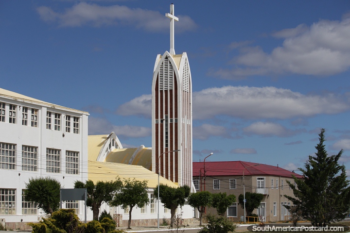 Parish of the Sacred Heart of Jesus with a tall tower and big cross, Puerto San Julian. (720x480px). Argentina, South America.