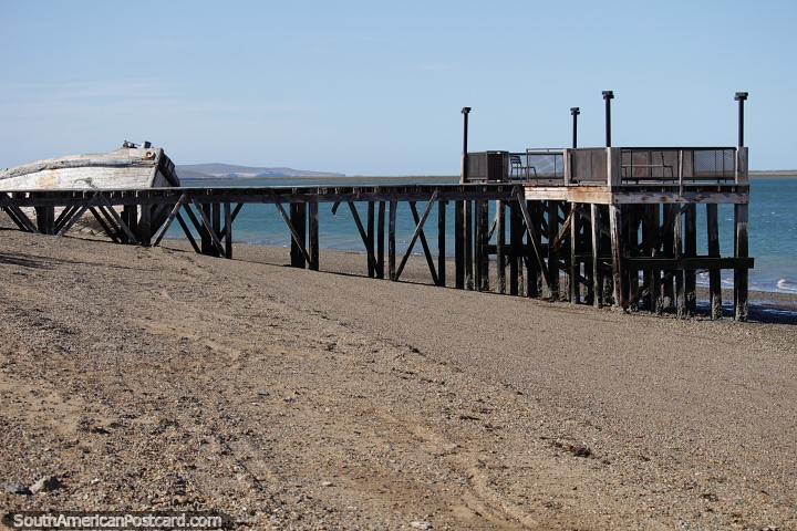 The old wooden dock on the beach in Puerto San Julian. (720x480px). Argentina, South America.