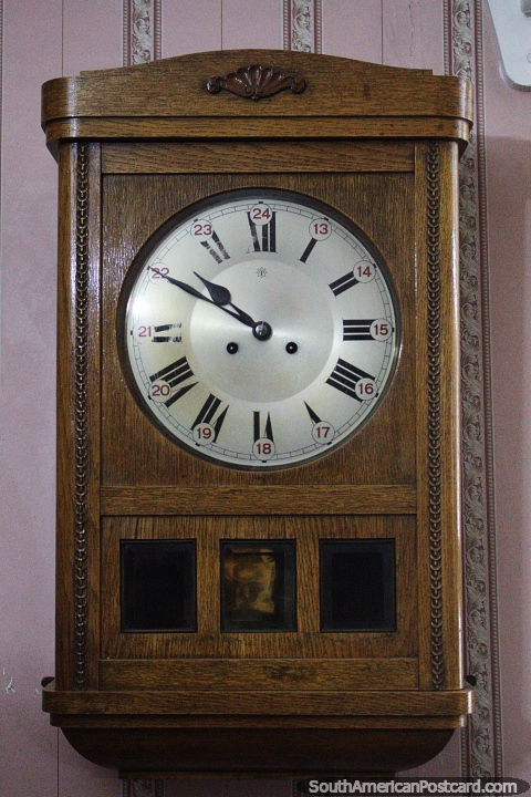 Antique wooden clock with numbers from 13 to 24, Pioneers museum, Rio Gallegos. (480x720px). Argentina, South America.