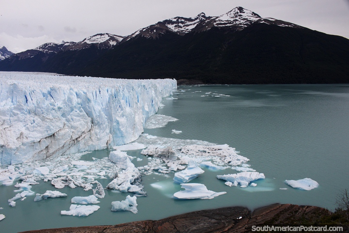 Large chunks of ice float after falling off Perito Moreno Glacier. (720x480px). Argentina, South America.
