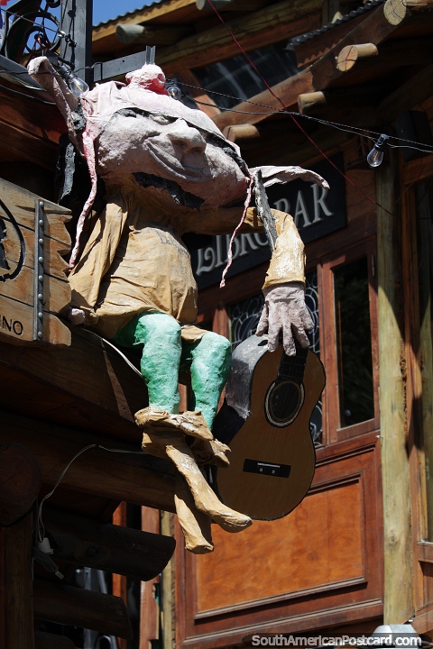 Gnome with a guitar and floppy hat waits to greet you in El Calafate. (480x720px). Argentina, South America.