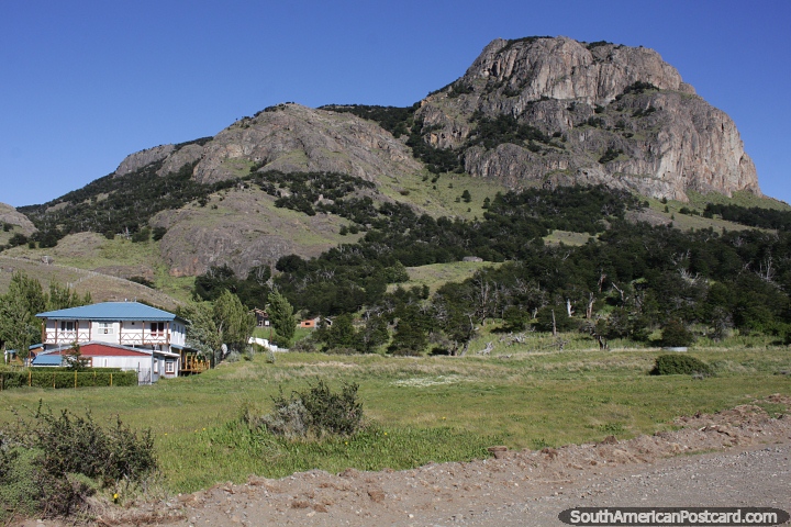 Huge bulging mountain towers over houses in El Chalten. (720x480px). Argentina, South America.