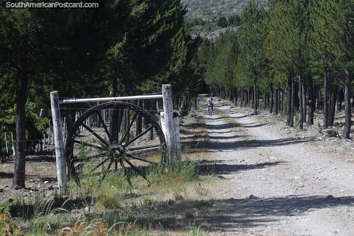 Countryside ranch with a wooden wheel at the entrance in Esquel. (720x480px). Argentina, South America.