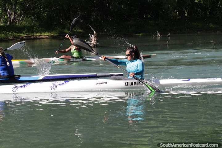 Action on the river, girls racing kayaks in Neuquen. (720x480px). Argentina, South America.