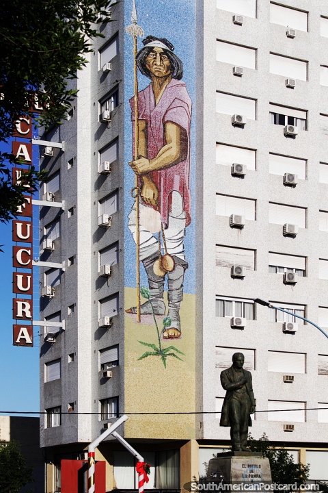 Indigenous man with a spear, huge mural on the side of the Calfucura Apart Hotel in Santa Rosa. (480x720px). Argentina, South America.