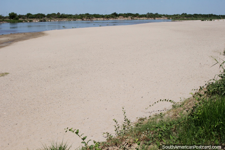 Big white sandy beach at the Dulce River and a hot climate in Santiago del Estero. (720x480px). Argentina, South America.