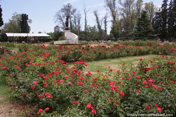 Flower gardens, trees and monument at Independence Park in Rosario. (720x480px). Argentina, South America.