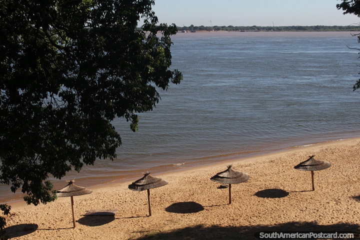 Umbrellas where the shade moves throughout the day, Islas Malvinas II Beach, Corrientes. (720x480px). Argentina, South America.