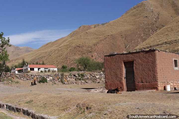 Mountainous terrain and a mud-brick house around Cuesta del Obispo, Route 33. (720x480px). Argentina, South America.