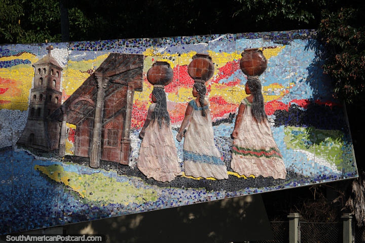 3 dames carrying urns on their heads walk to the church, ceramic artwork in Santa Cruz. (720x480px). Bolivia, South America.