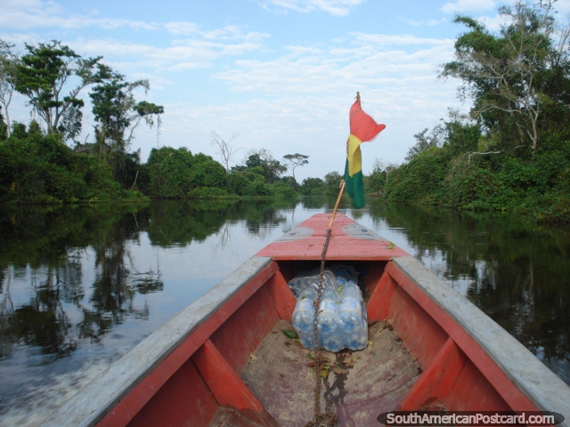 River boat with Bolivian flag, Rurrenabaque pampas. (640x480px). Bolivia, South America.