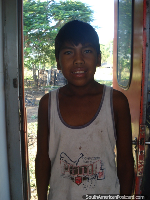 Young Bolivian boy had never seen a camera before, Santa Cruz to Quijarro. (480x640px). Bolivia, South America.
