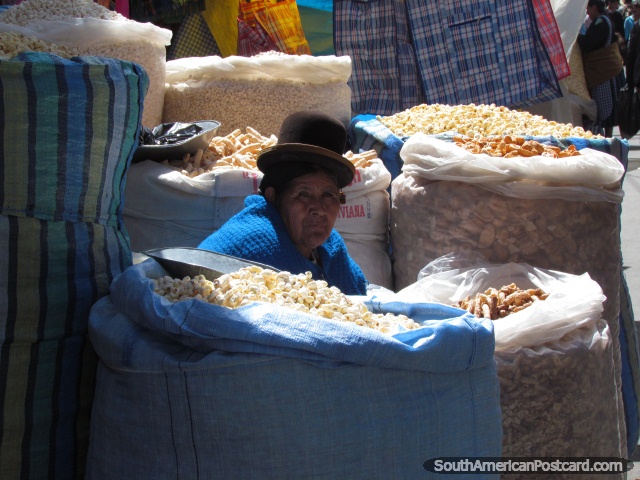 Woman sells produce from big sacks in La Paz street. (640x480px). Bolivia, South America.