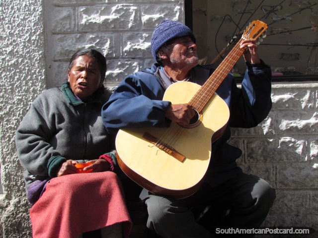 A blind couple busk with guitar and vocal each day in La Paz. (640x480px). Bolivia, South America.