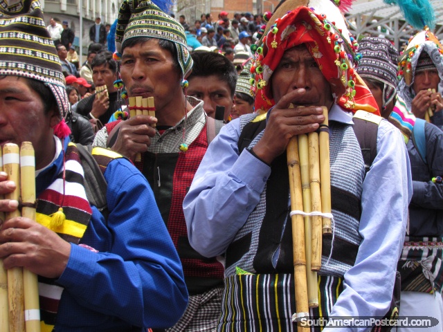 Pipe blowing indigenous men in La Paz. (640x480px). Bolivia, South America.