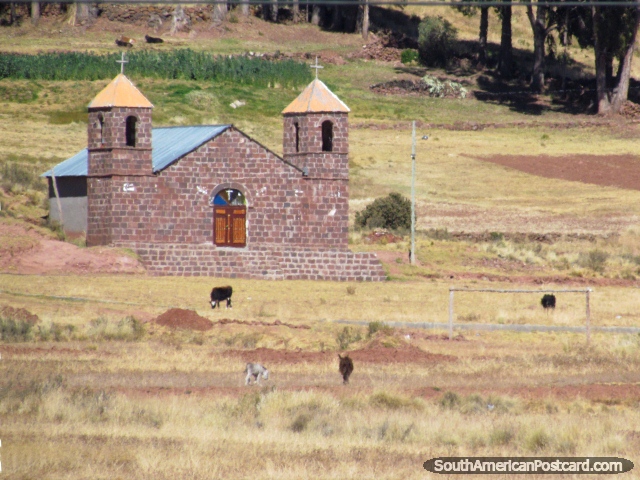 An old brick church with wooden door and 2 towers between Guaqui and Desaguadero.  (640x480px). Bolivia, South America.