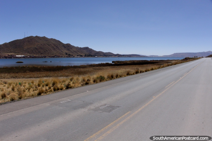 On the road out of Desaguadero towards Tiwanaku with the lake beside. (720x480px). Bolivia, South America.