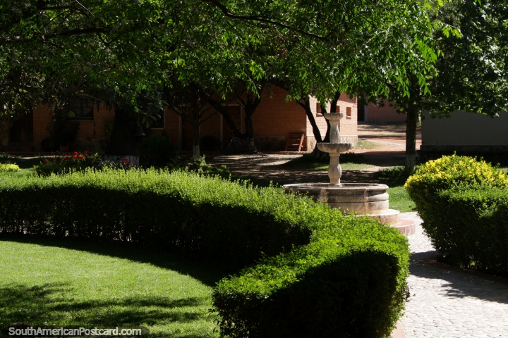The fountain, hedges and trees in the gardens at Kohlberg Vineyard in Tarija. (720x480px). Bolivia, South America.