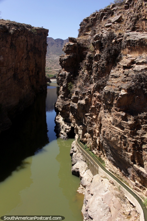A waterway runs beside the canyon in Tarija - Canon de la Angostura. (480x720px). Bolivia, South America.