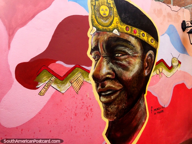 Man wearing a headband depicting the sun and musical instruments, mural in Copacabana. (640x480px). Bolivia, South America.